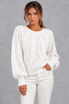 Women's cable-knit round-neck jumper in White – front view