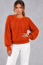 Women's cable-knit round-neck jumper in Burnt Orange – front view