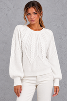 Women's cable-knit round-neck jumper in White – front close-up