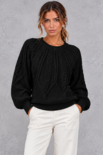 Women's cable-knit round-neck jumper in Black – front view