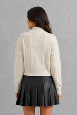 Women’s cable knit cardigan with feminine bow tie front, long sleeves and textured knitted design for autumn and winter layering.