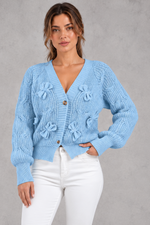 Women's cable knit bow cardigan in Light Blue – front view