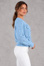 Women's cable knit bow cardigan in Light Blue – side view