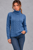 Women's cable knit roll neck jumper in Denim Blue – front view