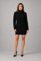 Shop this women’s cable knit roll neck mini dress with a relaxed fit, long sleeves and classic textured finish. Ideal for cosy autumn and winter wear.