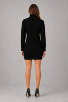 Shop this women’s cable knit roll neck mini dress with a relaxed fit, long sleeves and classic textured finish. Ideal for cosy autumn and winter wear.