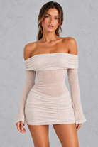 Women’s champagne glitter off-shoulder mini dress with sheer long flared sleeves, ruched detailing and an iridescent shimmer finish.