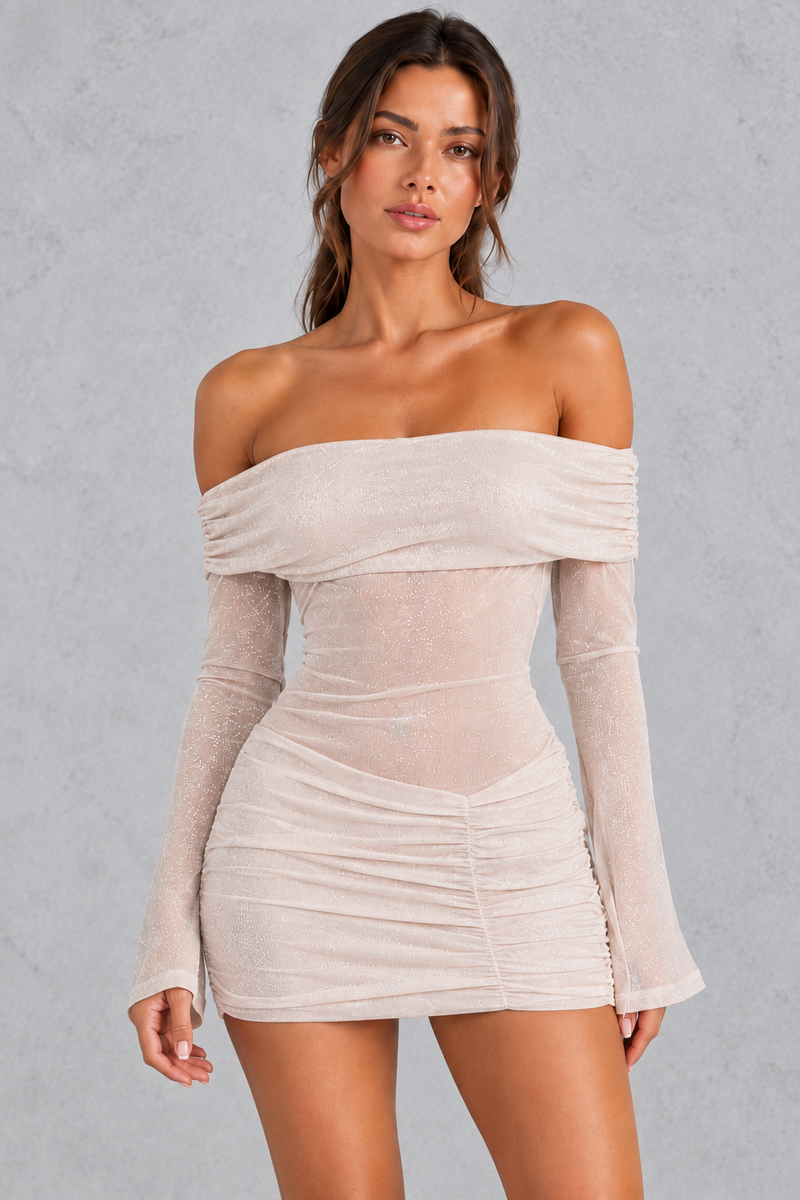 Women’s champagne glitter off-shoulder mini dress with sheer long flared sleeves, ruched detailing and an iridescent shimmer finish.