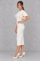 Women’s bodycon midi pencil dress with a round neckline, contrasting check-pattern sleeves, slim fit and elegant midi silhouette.