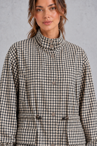 Women’s checked utility field jacket with a high stand collar, adjustable drawstring waist, multiple front pockets and elasticated cuffs.