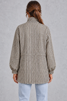 Women’s checked utility field jacket with a high stand collar, adjustable drawstring waist, multiple front pockets and elasticated cuffs.