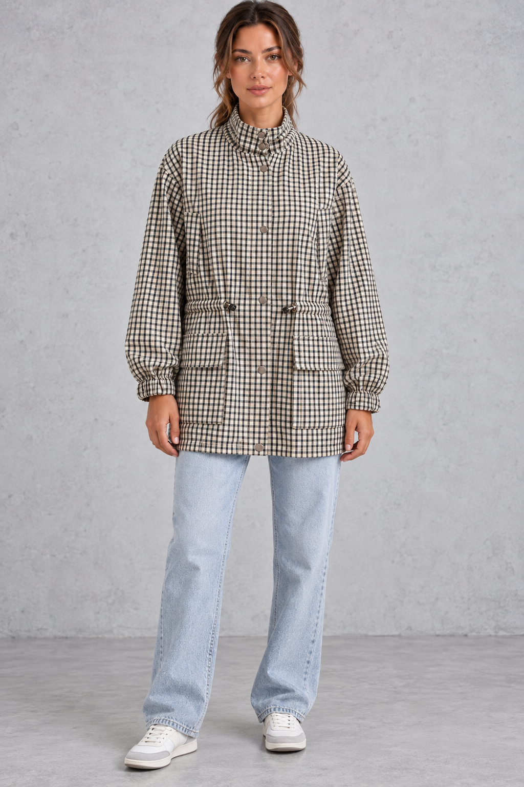 Women’s checked utility field jacket with a high stand collar, adjustable drawstring waist, multiple front pockets and elasticated cuffs.