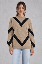 Women’s chevron knit crew neck jumper with a bold V-shaped pattern, dropped shoulders, long sleeves and ribbed trims.