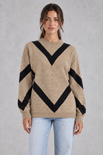 Women’s chevron knit crew neck jumper with a bold V-shaped pattern, dropped shoulders, long sleeves and ribbed trims.