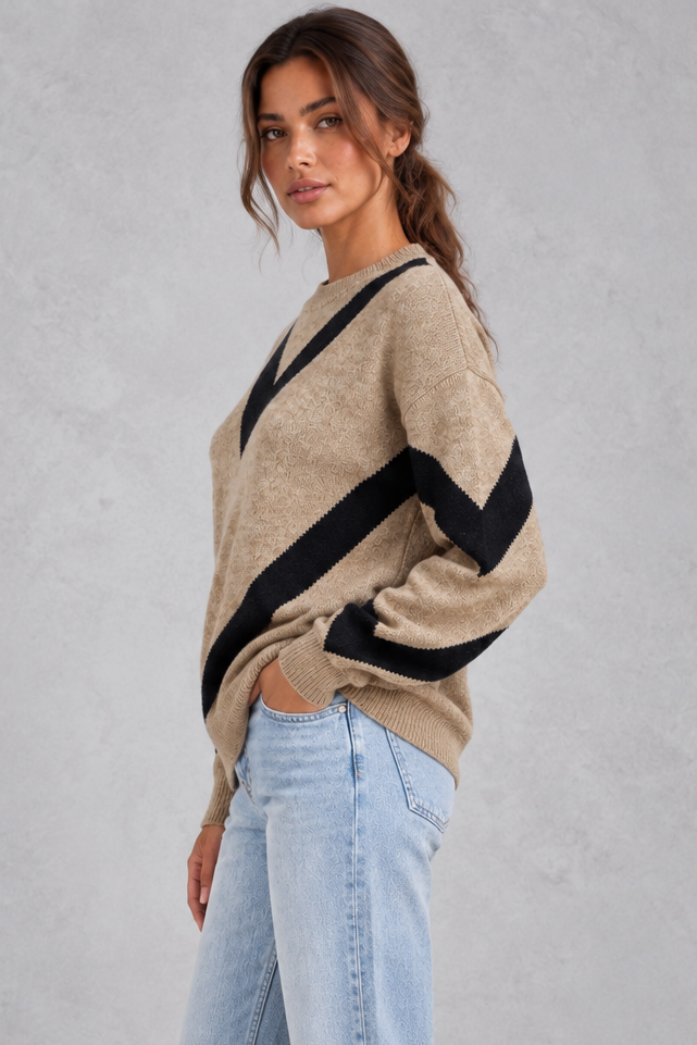 Women’s chevron knit crew neck jumper with a bold V-shaped pattern, dropped shoulders, long sleeves and ribbed trims.