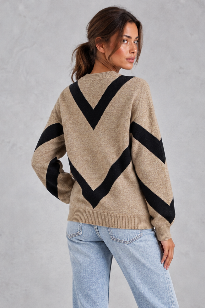 Women’s chevron knit crew neck jumper with a bold V-shaped pattern, dropped shoulders, long sleeves and ribbed trims.