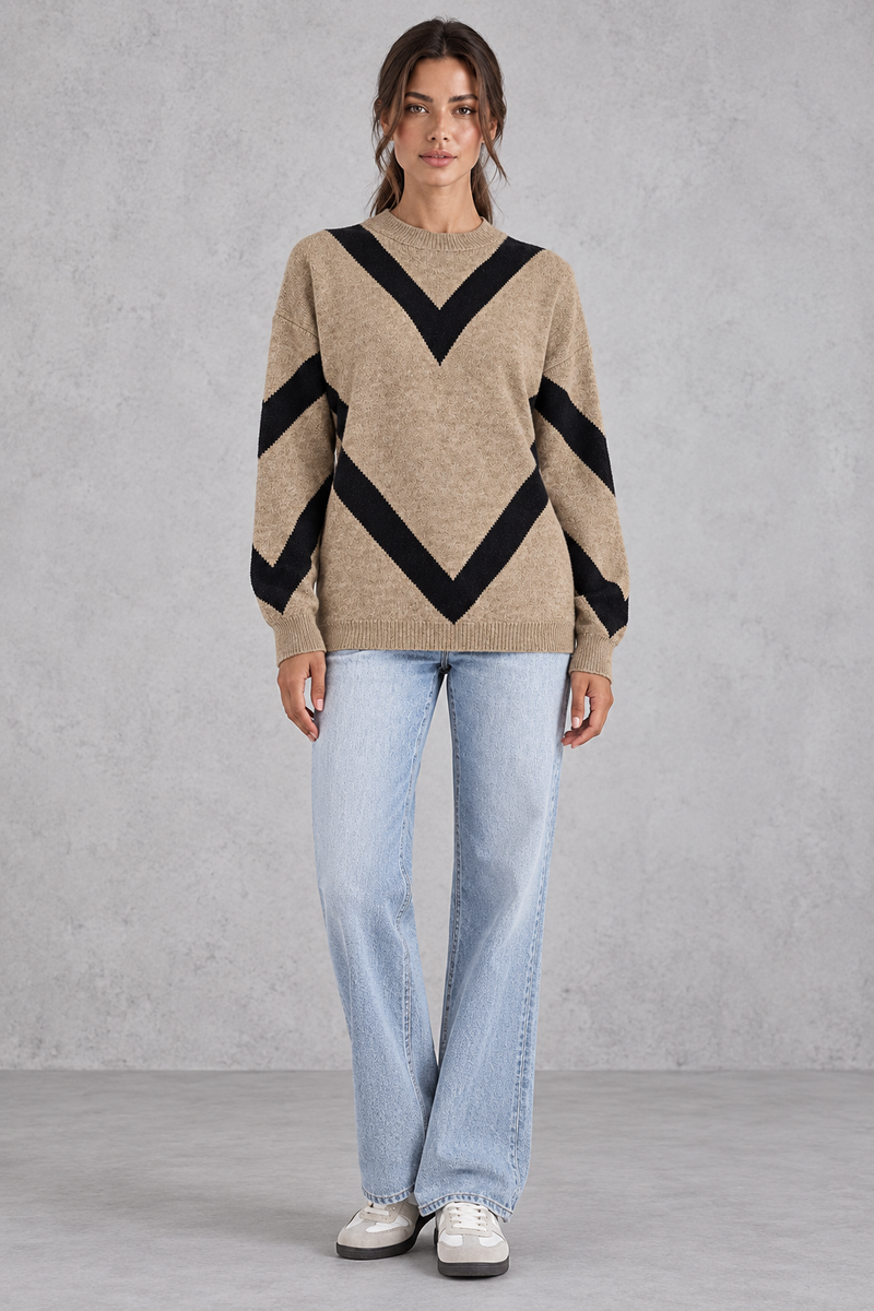 Women’s chevron knit crew neck jumper with a bold V-shaped pattern, dropped shoulders, long sleeves and ribbed trims.