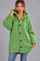 Women's chunky knit hooded cardigan in Green – front view