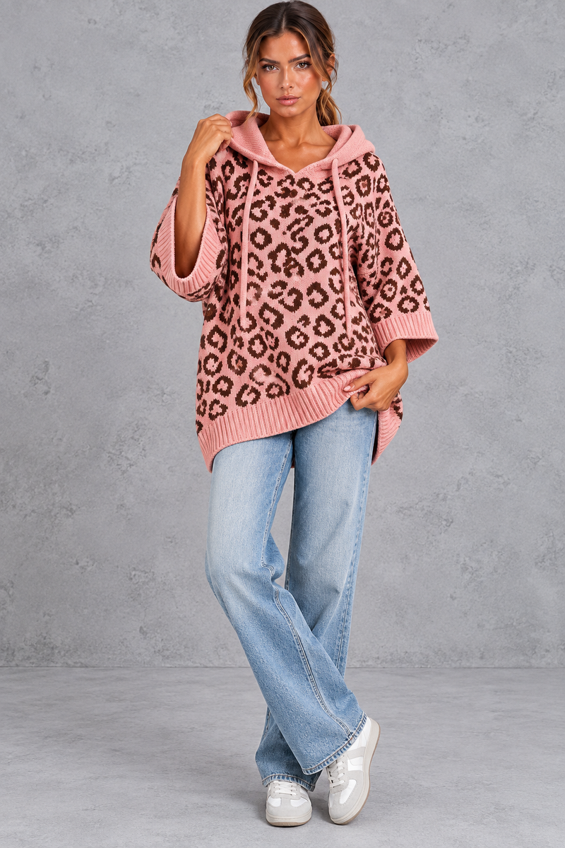 Women's pink leopard print knit hooded jumper styled with jeans – full-length front view