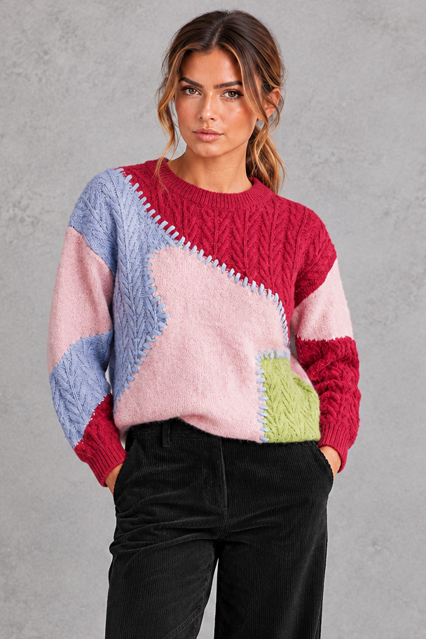 Women's patchwork cable knit jumper in Pink – front view