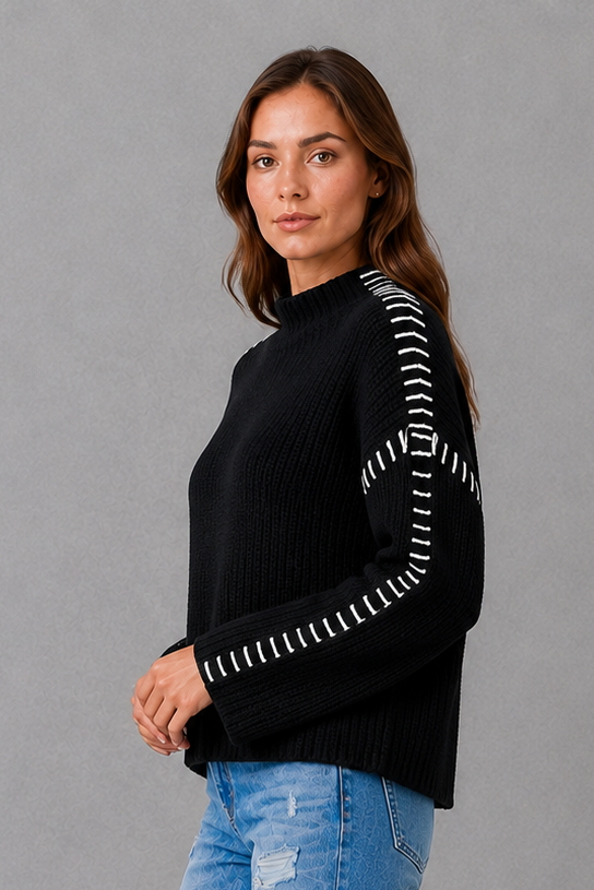 Women’s oversized black crew neck knit jumper with white contrast stitch detailing across the shoulders and long sleeves.