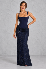 Women’s  corset maxi dress with a structured crepe bodice, square neckline, adjustable straps and embellished tulle cowl skirt.