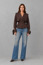 Women’s cotton short trench jacket with double-breasted button front, notch lapels, long sleeves and adjustable belted waist.