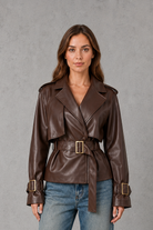 Women’s cotton short trench jacket with double-breasted button front, notch lapels, long sleeves and adjustable belted waist.