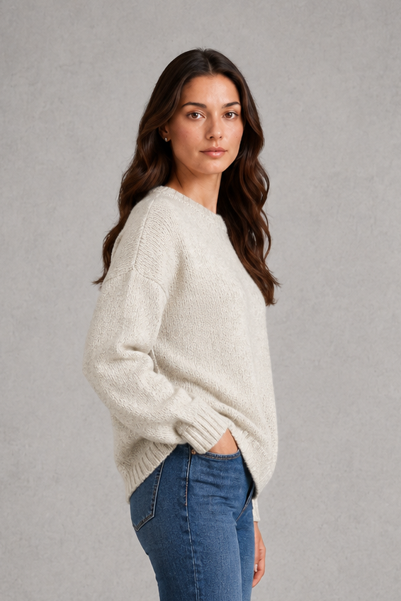 Light grey women’s crew neck knit jumper with an oversized relaxed fit, dropped shoulders and loose wide long sleeves.