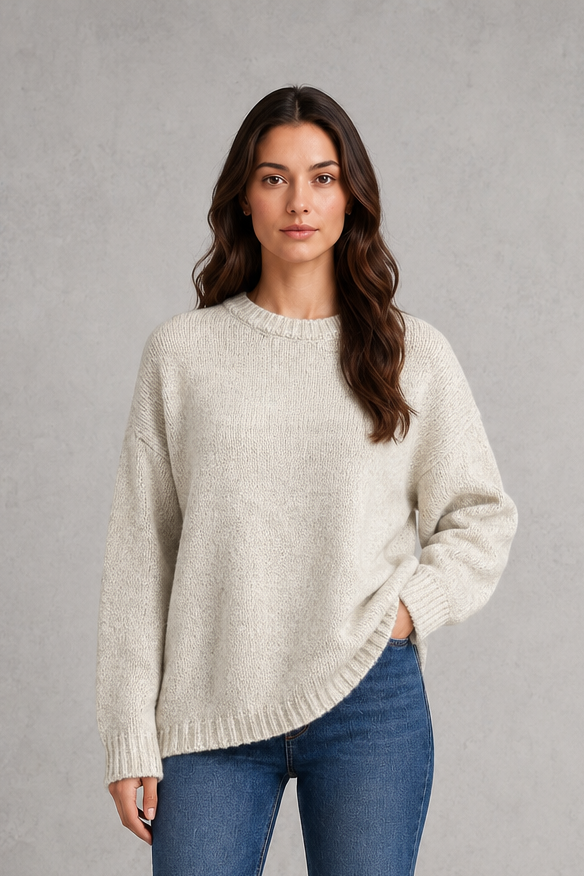 Light grey women’s crew neck knit jumper with an oversized relaxed fit, dropped shoulders and loose wide long sleeves.