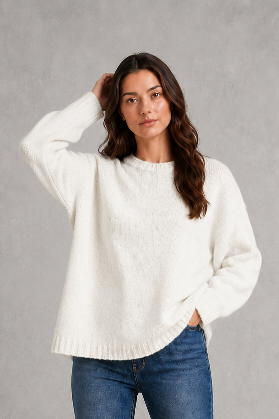 Light grey women’s crew neck knit jumper with an oversized relaxed fit, dropped shoulders and loose wide long sleeves.
