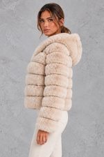 Women’s cropped faux fur winter jacket with a plush hood, horizontal panelled detailing, long sleeves and a voluminous silhouette.