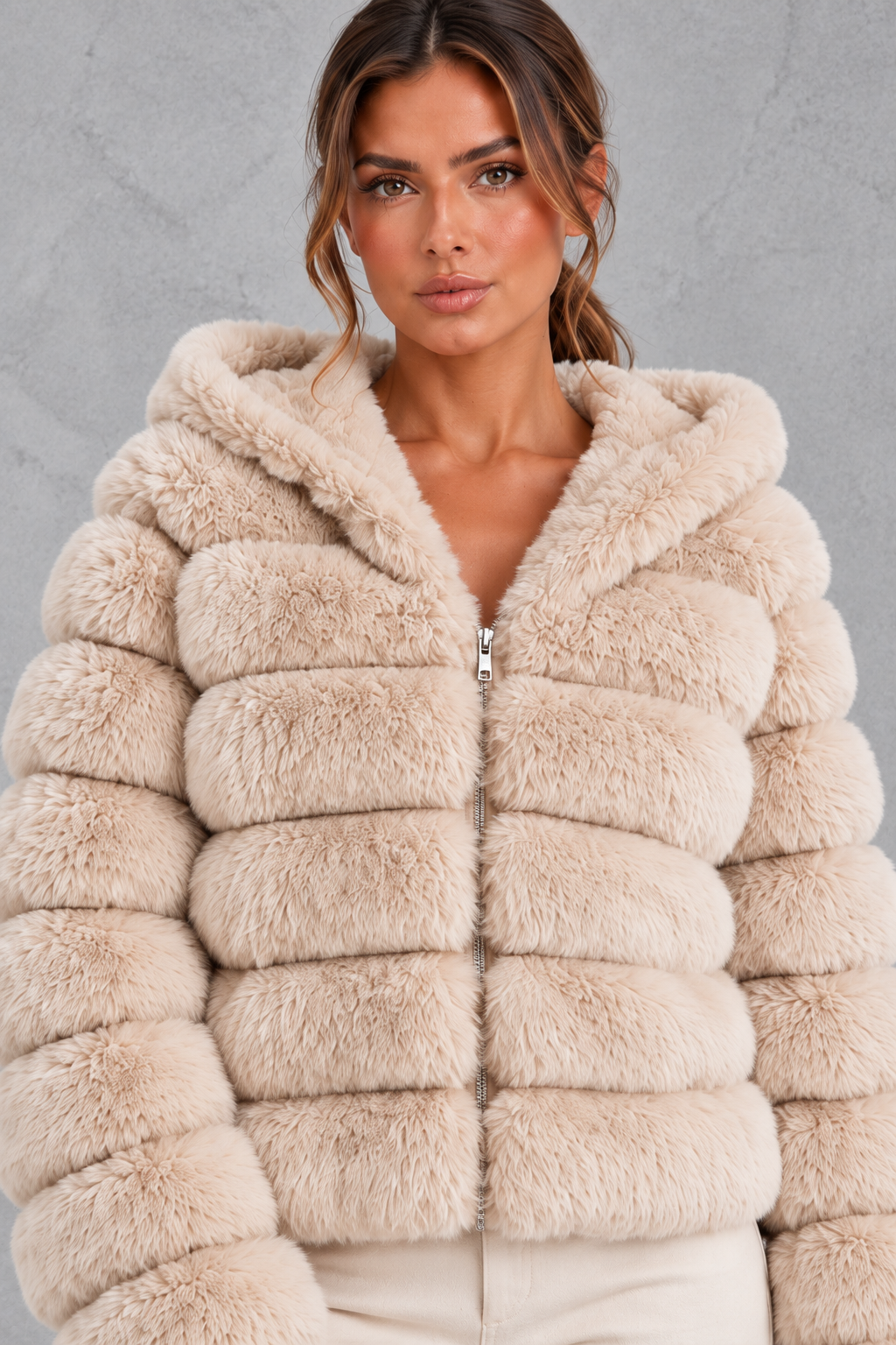 Women’s cropped faux fur winter jacket with a plush hood, horizontal panelled detailing, long sleeves and a voluminous silhouette.