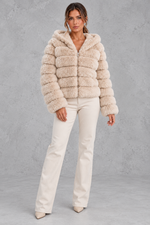 Women’s cropped faux fur winter jacket with a plush hood, horizontal panelled detailing, long sleeves and a voluminous silhouette.