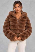 Women’s cropped faux fur winter jacket with a plush hood, horizontal panelled detailing, long sleeves and a voluminous silhouette.