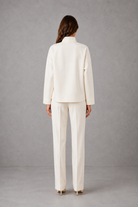 Women’s cropped V-neck jacket and high-waisted cigarette trouser two-piece set with chest patch pockets and a smart casual tailored silhouette.