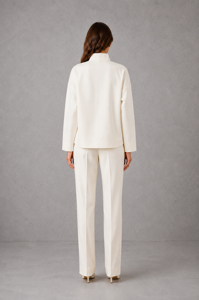 Women’s cropped V-neck jacket and high-waisted cigarette trouser two-piece set with chest patch pockets and a smart casual tailored silhouette.