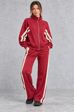 Women's red zip-up tracksuit set with cream side stripes – front view