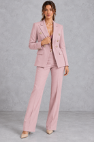 Women's double-breasted blazer and trousers set in Blush Pink – front view