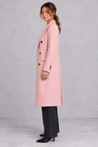 Women's double-breasted longline coat in Pink – side view