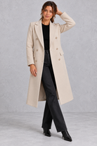 Women's double-breasted longline coat in Beige – front view