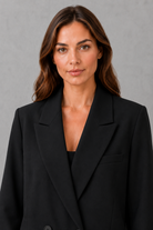 Women’s oversized double breasted blazer with wide peak lapels, structured shoulders, front patch pockets and a classic tailored silhouette.