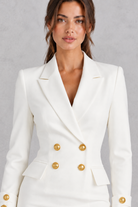 Women’s double-breasted blazer dress with a V-neckline, long sleeves and a sleek wrap-inspired tailored silhouette.