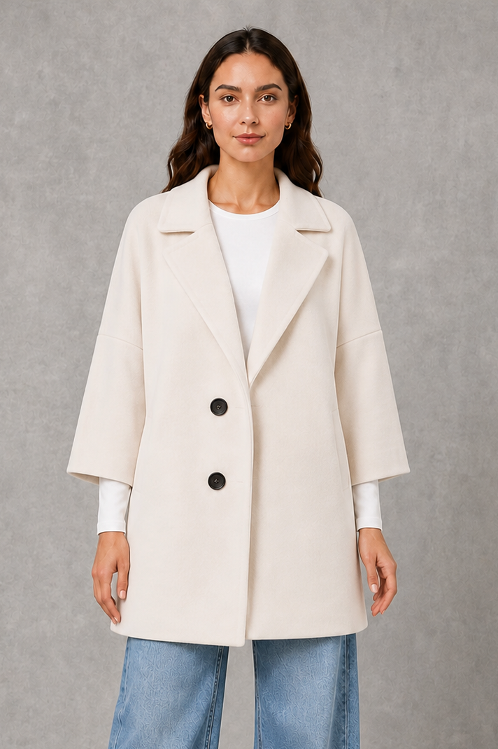 Women’s elegant longline coat with a classic tailored silhouette and lightweight finish, ideal for polished spring and autumn layering.