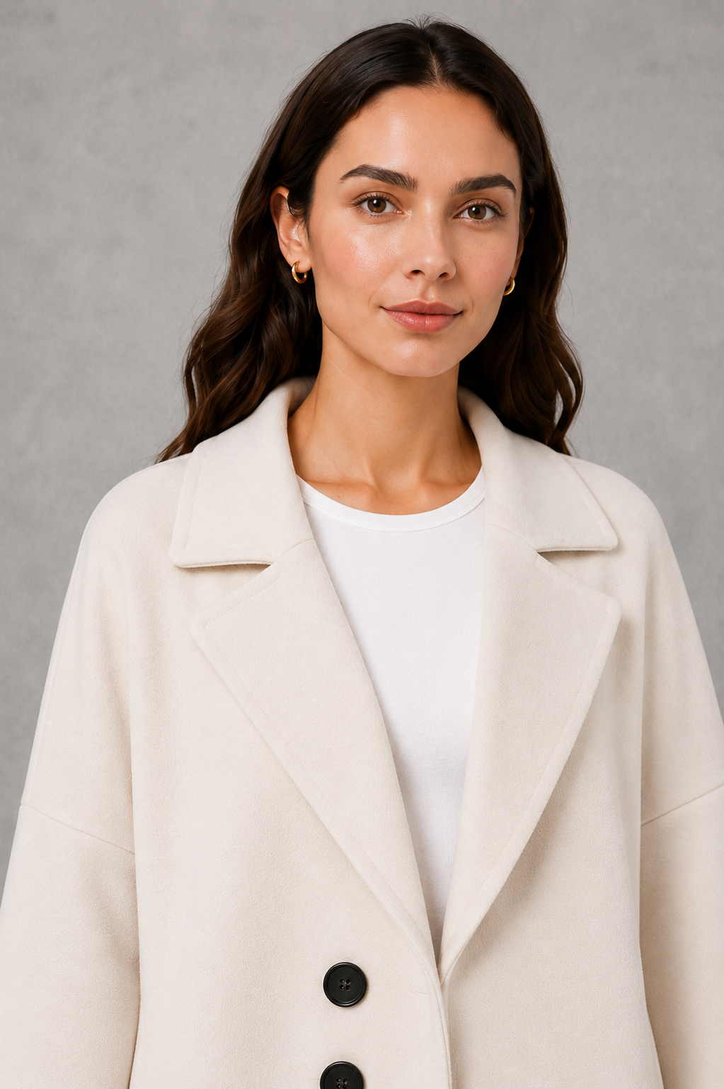 Women’s elegant longline coat with a classic tailored silhouette and lightweight finish, ideal for polished spring and autumn layering.