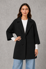 Women’s elegant longline coat with a classic tailored silhouette and lightweight finish, ideal for polished spring and autumn layering.