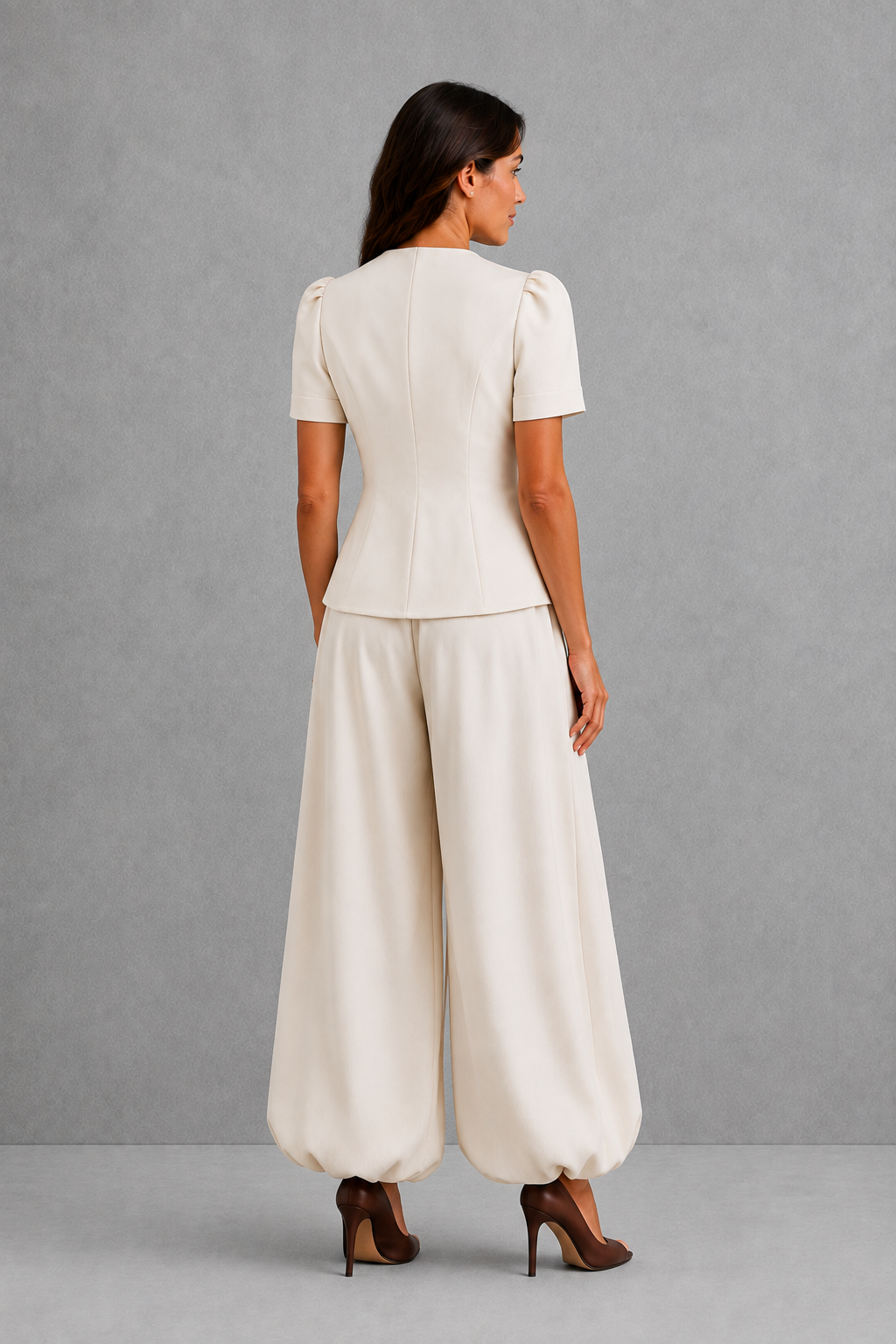 Women’s elegant two piece trouser set with tailored top and ankle-length balloon leg trousers.