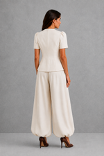 Women’s elegant two piece trouser set with tailored top and ankle-length balloon leg trousers.