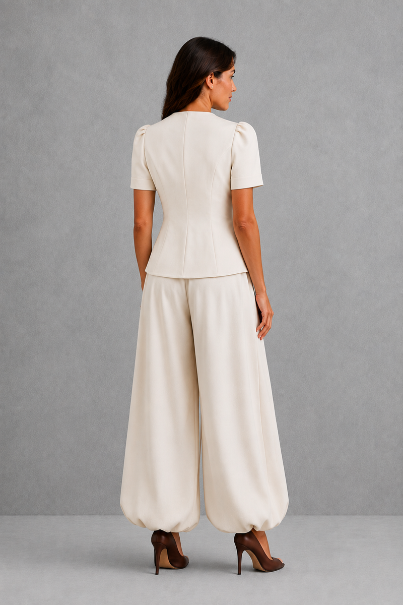 Women’s elegant two piece trouser set with tailored top and ankle-length balloon leg trousers.