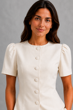 Women’s elegant two piece trouser set with tailored top and ankle-length balloon leg trousers.
